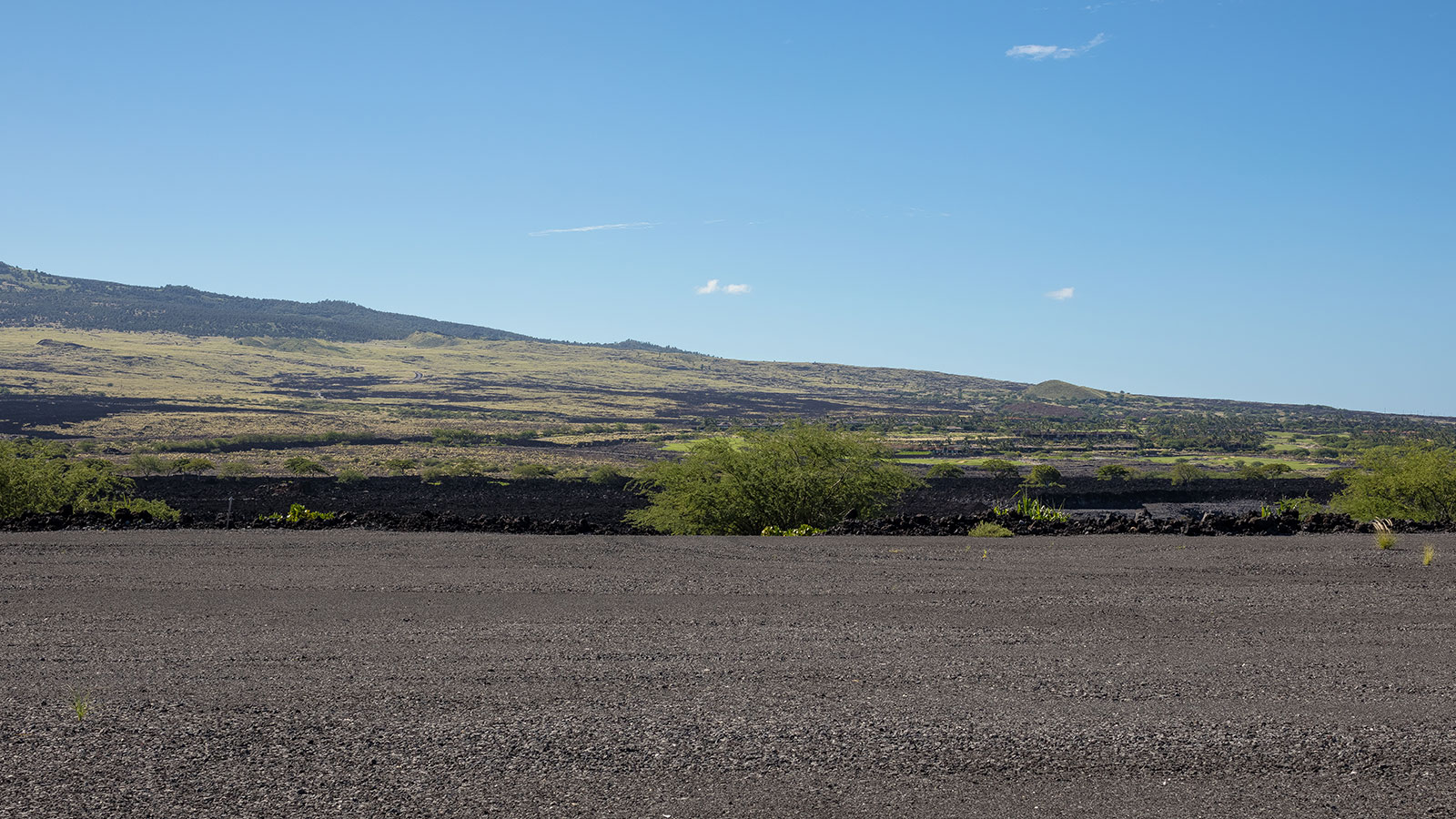 Dramatic geography features lava fields rolling out across big island Hawaii