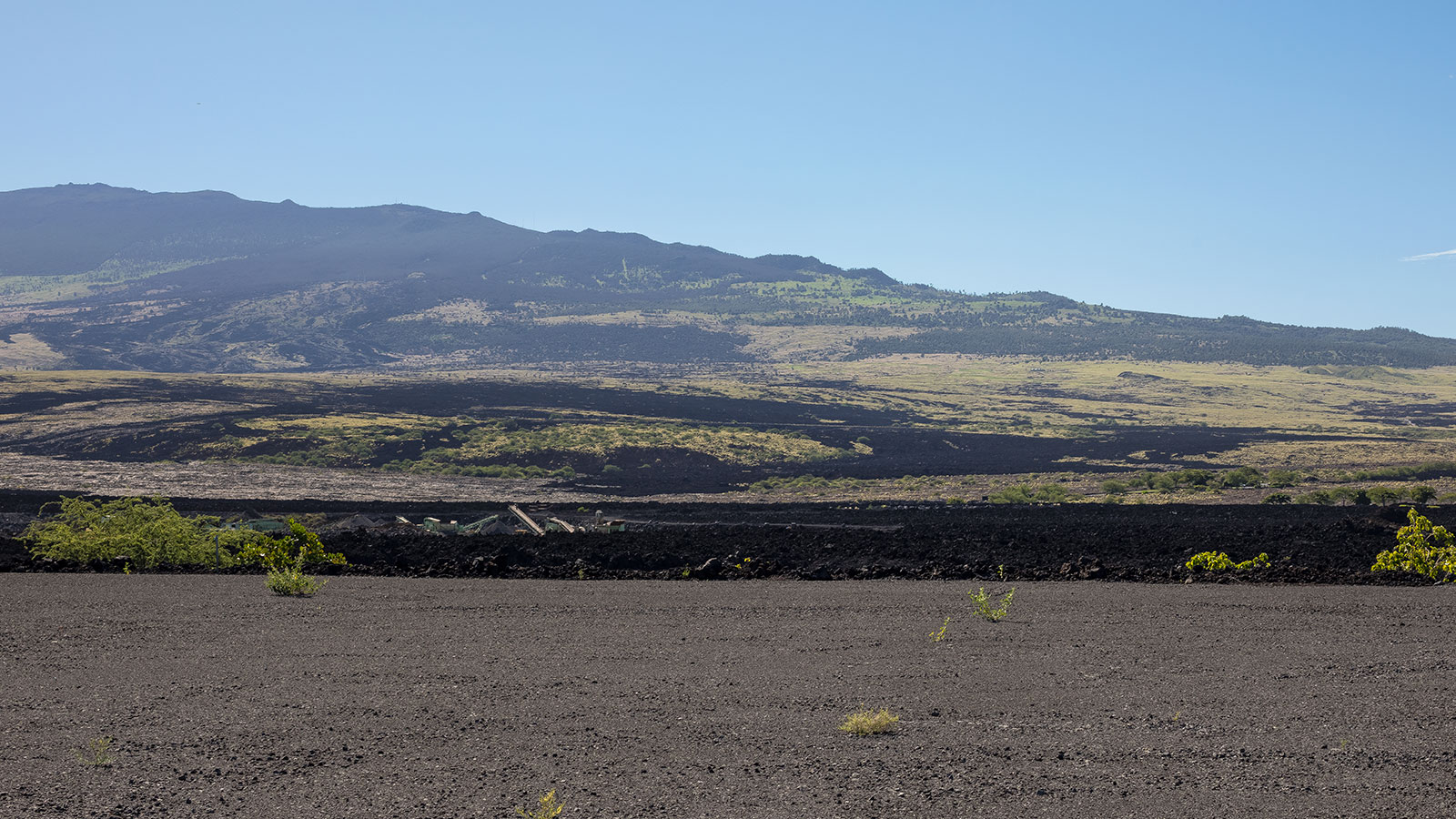 Dramatic geography features lava fields rolling out across big island Hawaii
