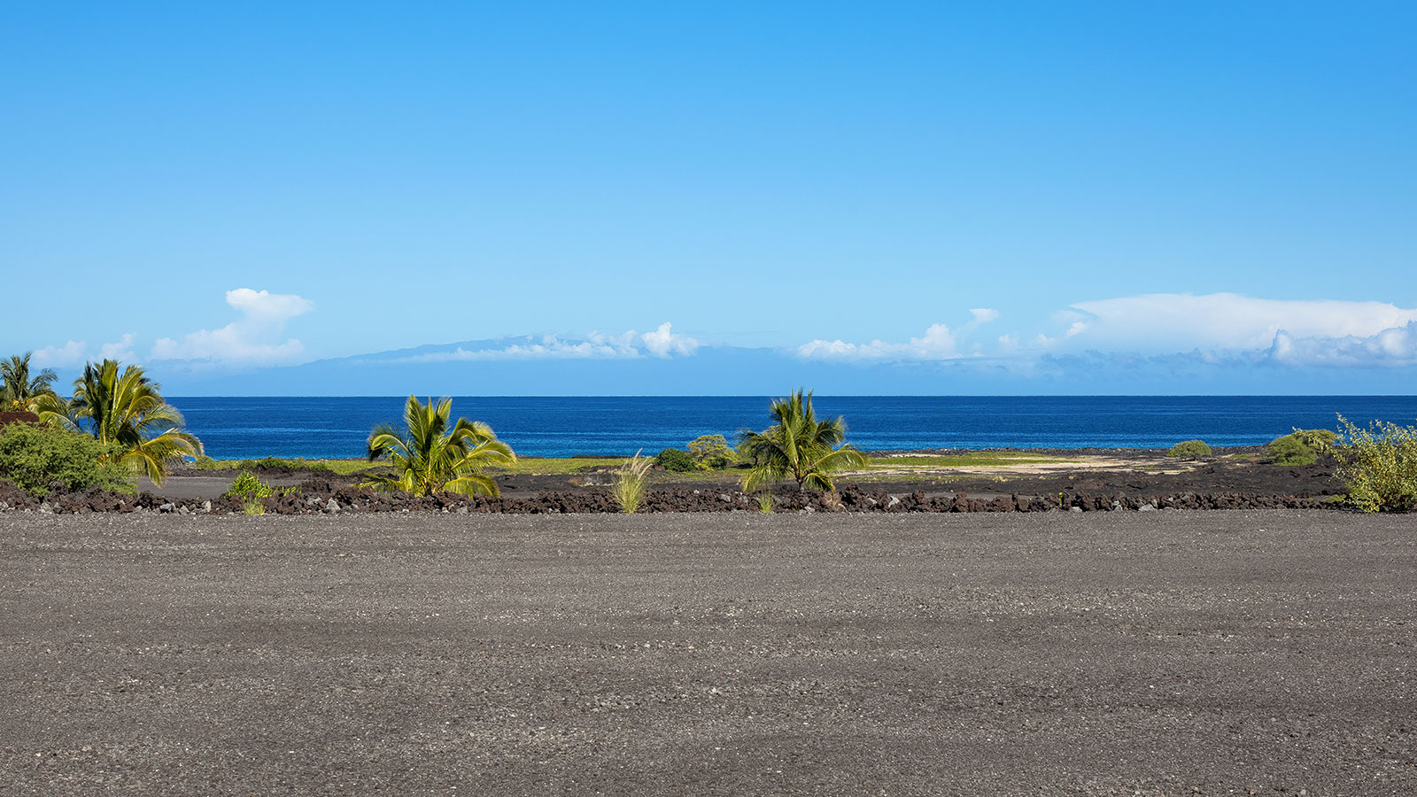 Volcanic flows at the edge of the ocean create a rugged shoreline