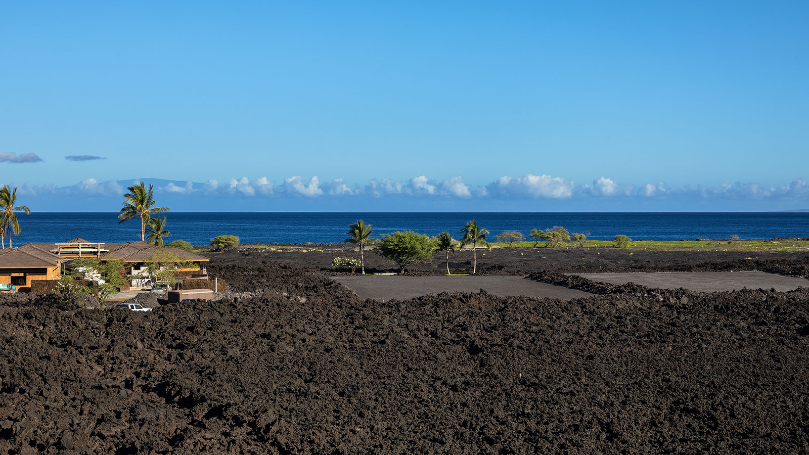 Volcanic flows at the edge of the ocean create a rugged shoreline