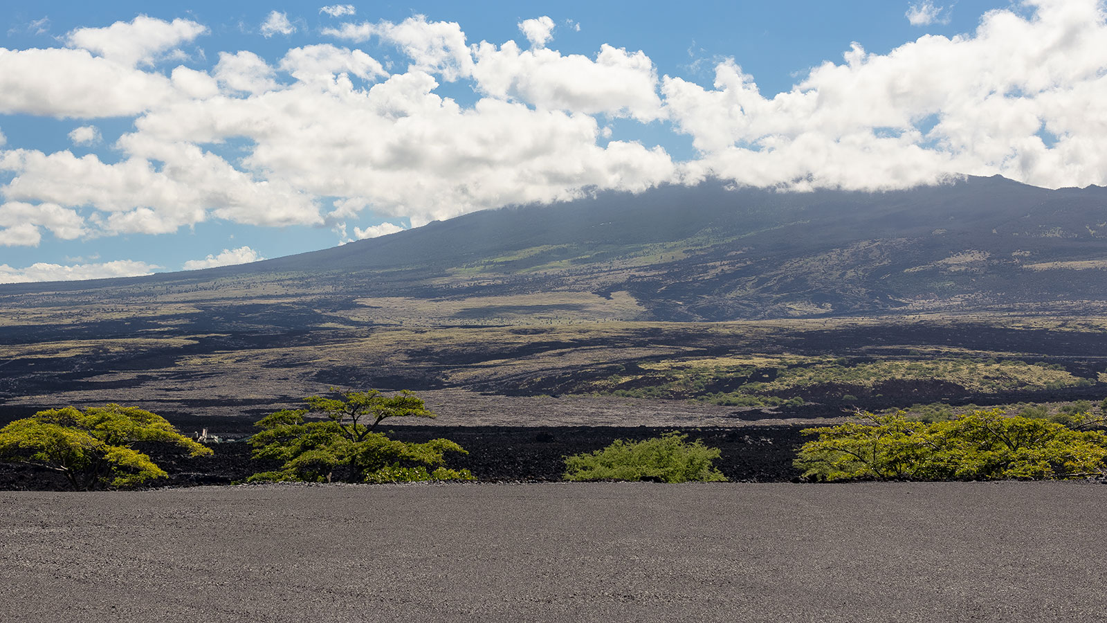 Dramatic geography features lava fields rolling out across big island Hawaii