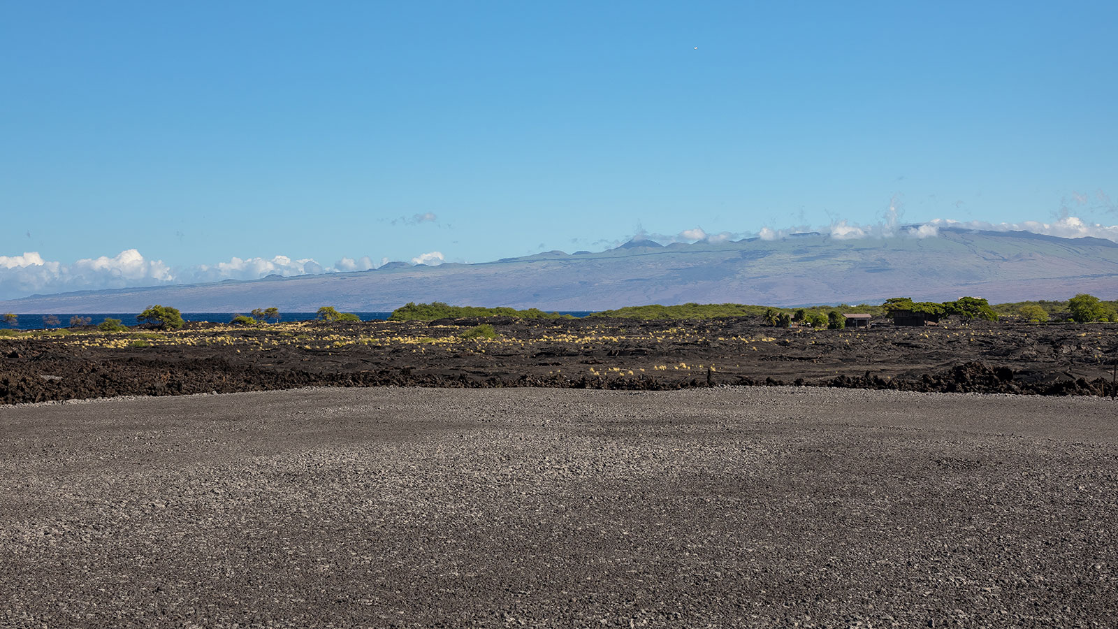 Volcanic flows at the edge of the ocean create a rugged shoreline