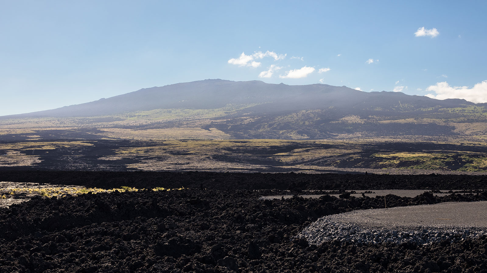 Volcanic flows at the edge of the ocean create a rugged shoreline