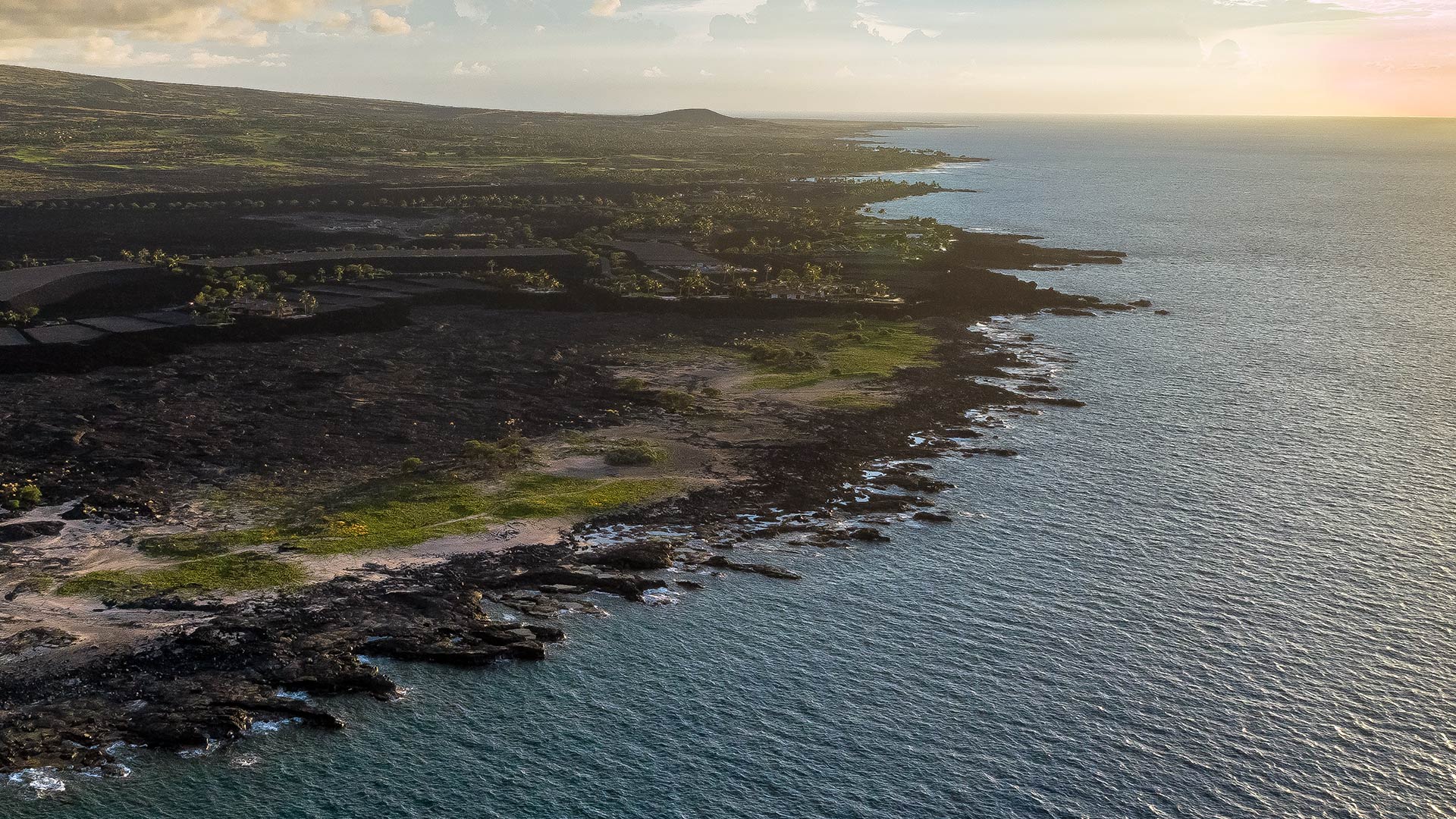 Volcanic flows at the edge of the ocean create a rugged shoreline